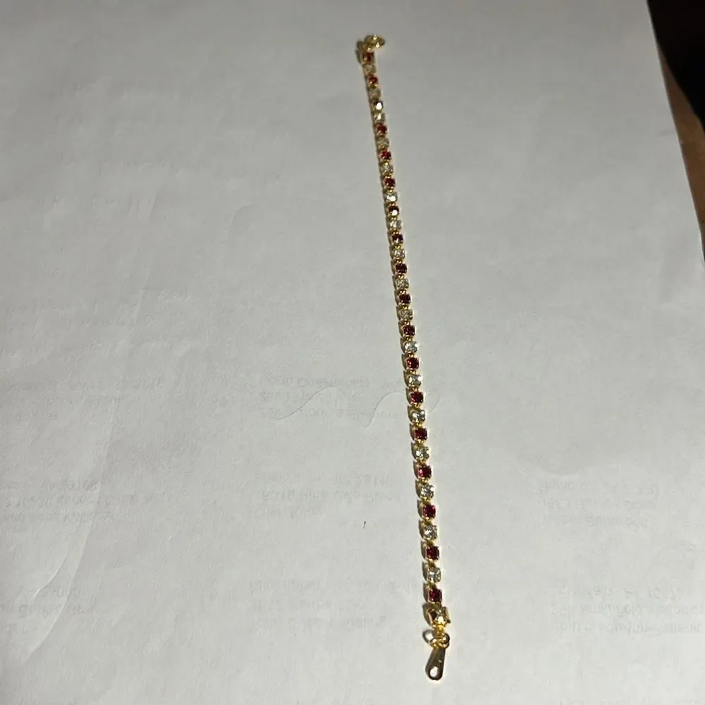 Ladies 8” faux Ruby/Diamond tennis bracelet.